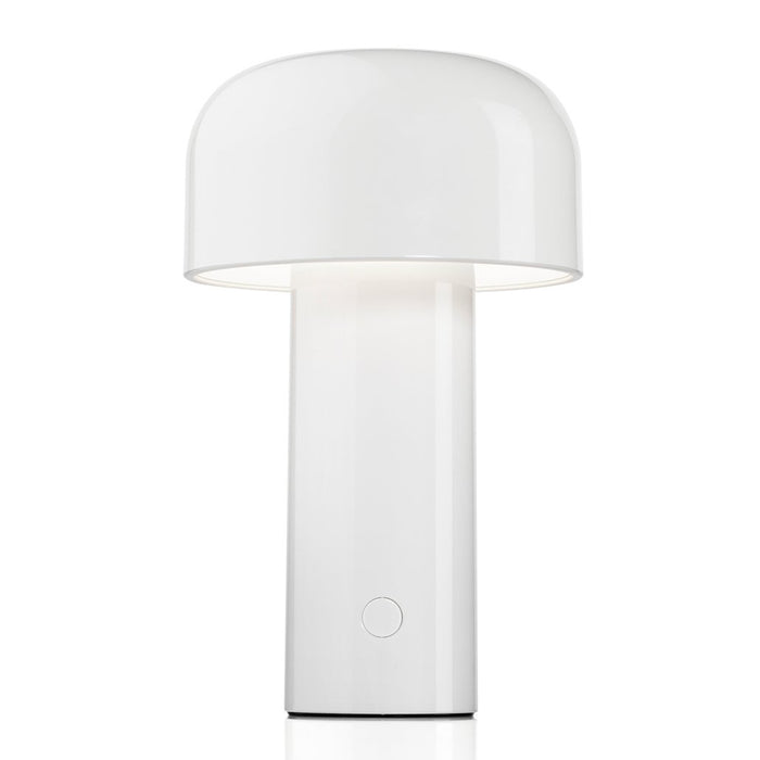The Flos Bellhop Portable Lamp, IP54, is a modern, cordless white table lamp with a cylindrical base and dome-shaped shade, featuring an easy-to-use circular button near the bottom for control.