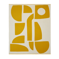Sophie Home Bruten throw blanket in off-white with a bold, abstract pattern of yellow geometric shapes.
