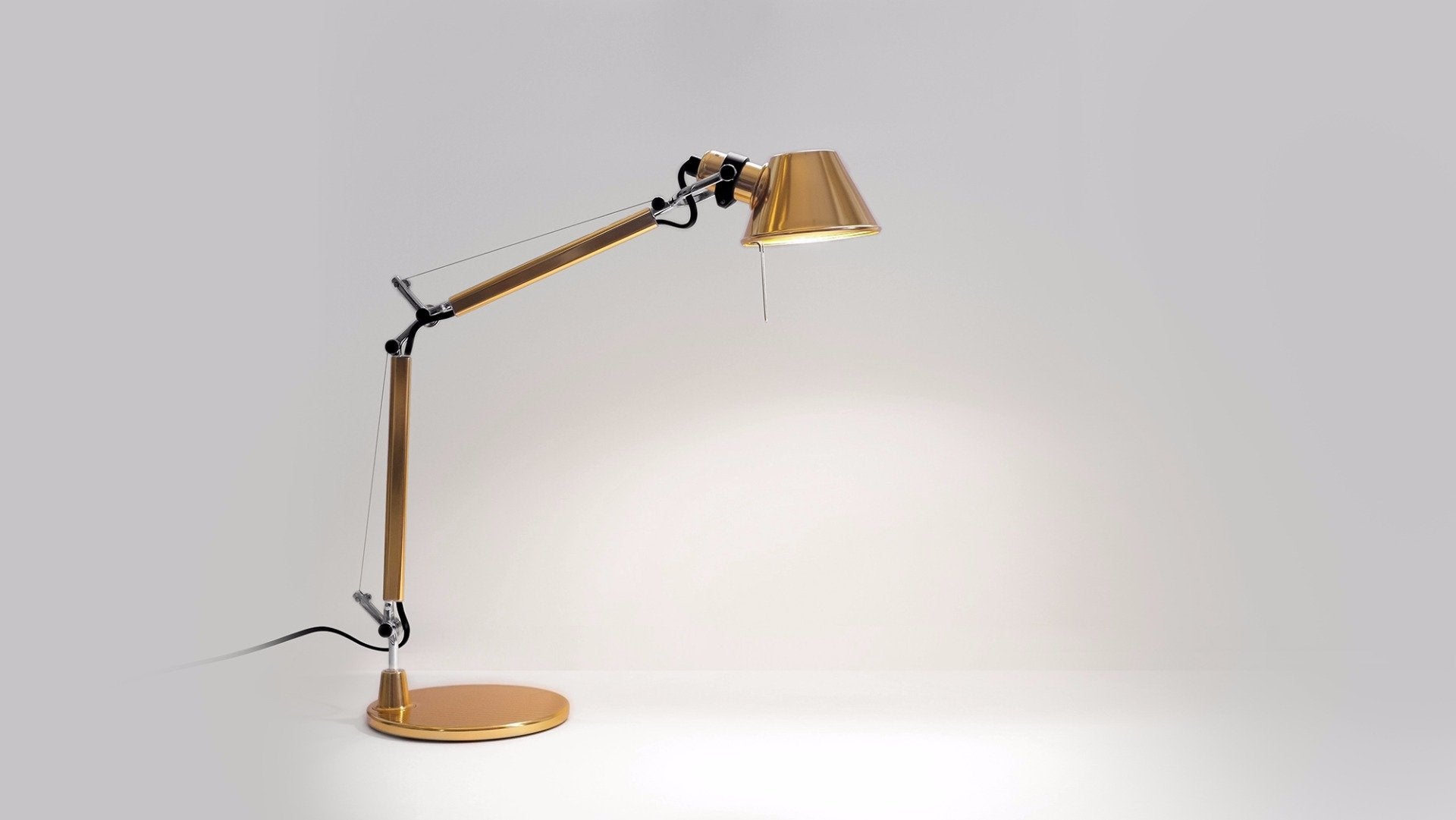 Tolomeo Micro Lamp, Gold by Artemide | desk-lights | Aria London